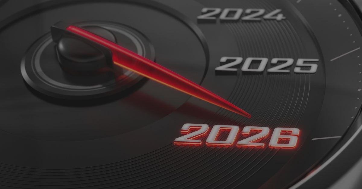 A vehicle speedometer with the years 2021-2026 on it. The needle is pointed to 2026 in red.