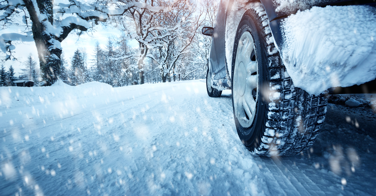Winter tires driving on a snowy road